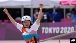 Momiji Nishiya of Japan reacts after winning the women's street skateboarding finals at the 2020 Summer Olympics, July 26, 2021, in Tokyo, Japan. 