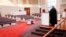 FILE - In this March 15, 2020 photo, the Rev. Kip Rush delivers his sermon in a sanctuary filled with mostly empty pews during a service amid coronavirus fears in Brentwood, Tenn.