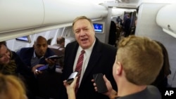U.S. Secretary of State Mike Pompeo speaks to reporters aboard his plane en route to London, Jan. 29, 2020. Pompeo is to meet British Prime Minister Boris Johnson and other officials.