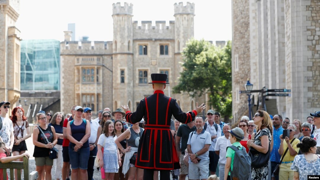 A Yeoman Warder, Barney Chandler, leads the first "Beefeater" tour of the Tower of London in 16 months, at the Tower of London, Britain, July 19, 2021. 