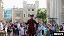 A Yeoman Warder, Barney Chandler, leads the first "Beefeater" tour of the Tower of London in 16 months, at the Tower of London, Britain, July 19, 2021. 