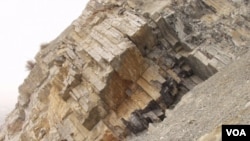 FILE - Limestone layers in between volcanic ash beds from Meishan, China, during the "Great Die-Off" (Courtesy: Shuzhong Shen).