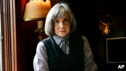 FILE - Author Anne Rice poses for a photo at her home Oct. 26, 2005, in San Diego. 