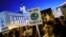A woman holds a placard reading "There is no Planet B" during a protest demanding global politicians urgent actions to fight climate change in Madrid, Spain, September 27, 2019. REUTERS/Juan Medina