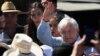 Mexican President Andres Manuel Lopez Obrador waves as he arrives for a meeting with dairy farmers in La Chona de Encarnacion de Diaz, Jalisco, Mexico, March 9, 2019.