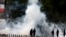 Kenyan police use tear gas to disperse Nairobi University Students, who rioted over the death of two of their colleagues, in Nairobi. The students said they wanted an explanation of how the two engineering students died within a day while in police custody.