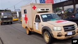 Liberian soldiers in a medical truck, with papers on it reading 'EBOLA MOST GO' drive past as they patrol streets to prevent panic, as fears of the deadly Ebola virus spread in the city of Monrovia, Liberia, Friday, Aug 1, 2014. U.S. health officials war