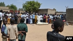 Mourners take part in a funeral ceremony for eighteen year-old Synna Garandi, in N'Djamena, May 1, 2021, after his death during a protest April 27 in the Chadian capital. 