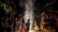 FILE - Children play with firecrackers during Diwali celebrations in New Delhi, India, on Nov. 4, 2021.