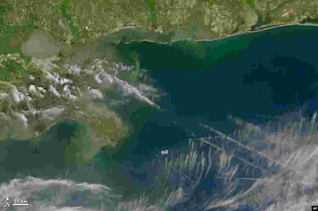 A damaged oil well may be leaking five times more oil into the Gulf of Mexico than officials first estimated, 28 Apr 2010. (NASA Image)