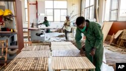 FILE—A worker touches a table at a bamboo factory in Wakiso, Uganda on March 13, 2024.