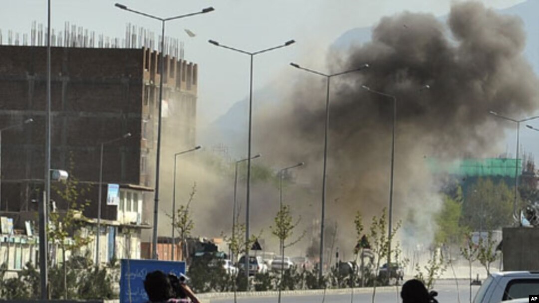 Smoke rises from the site of an attack near the Afghan parliament in Kabul April 15, 2012.