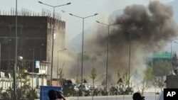 Smoke rises from the site of an attack near the Afghan parliament in Kabul April 15, 2012.