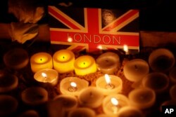 People light candles at a vigil for the victims of Wednesday's attack, at Trafalgar Square in London, March 23, 2017.