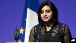 Pakistan's Gulalai Ismail delivers an acceptance speech after being awarded the Prize for Conflict Prevention for the work of her organization Aware Girls promoting women's issues and equality in Pakistan, during the award ceremony of the Jacques Chirac Foundation in Paris, Nov. 24 2016.