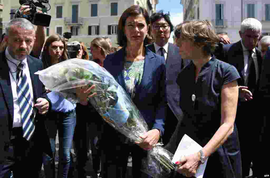 Italian Lower House Speaker Laura Boldrini (C) and France's ambassador to Italy Catherine Colonna (R) arrive at the French Embassy in Rome to lay a wreath of flowers on July 15, 2016, after the deadly attack in Nice. 