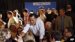 U.S. Republican presidential candidate Mitt Romney greets supporters after speaking at a pancake breakfast in Wauwatosa, Wisconsin, April 1, 2012. 