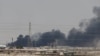 Asap membubung setelah fasilitas pengolahan minyak Aramco di Kota Abqaiq terbakar, Arab Saudi, 14 September 2019. 