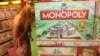 A woman inspects a display of the latest South African version of the world-famous Monopoly board game. (D. Taylor/ VOA)