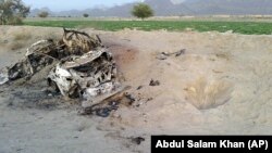 Photo taken on cellphone purports to show the destroyed vehicle in which Mullah Mohammad Akhtar Mansour was traveling in the Ahmad Wal area in Baluchistan province of Pakistan, near Afghanistan's border, May 22, 2016.