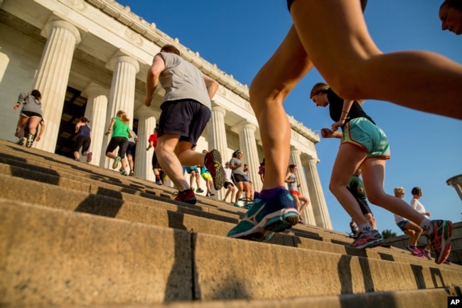 In this May 25, 2016 photo, members of the running group "November Project" run up and down the stairs of the Lincoln Memorial, in Washington. (AP Photo/Andrew Harnik)