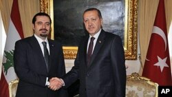 黎巴嫩总理哈里里(左)周五在安卡拉与土耳其总理埃尔多安会晤