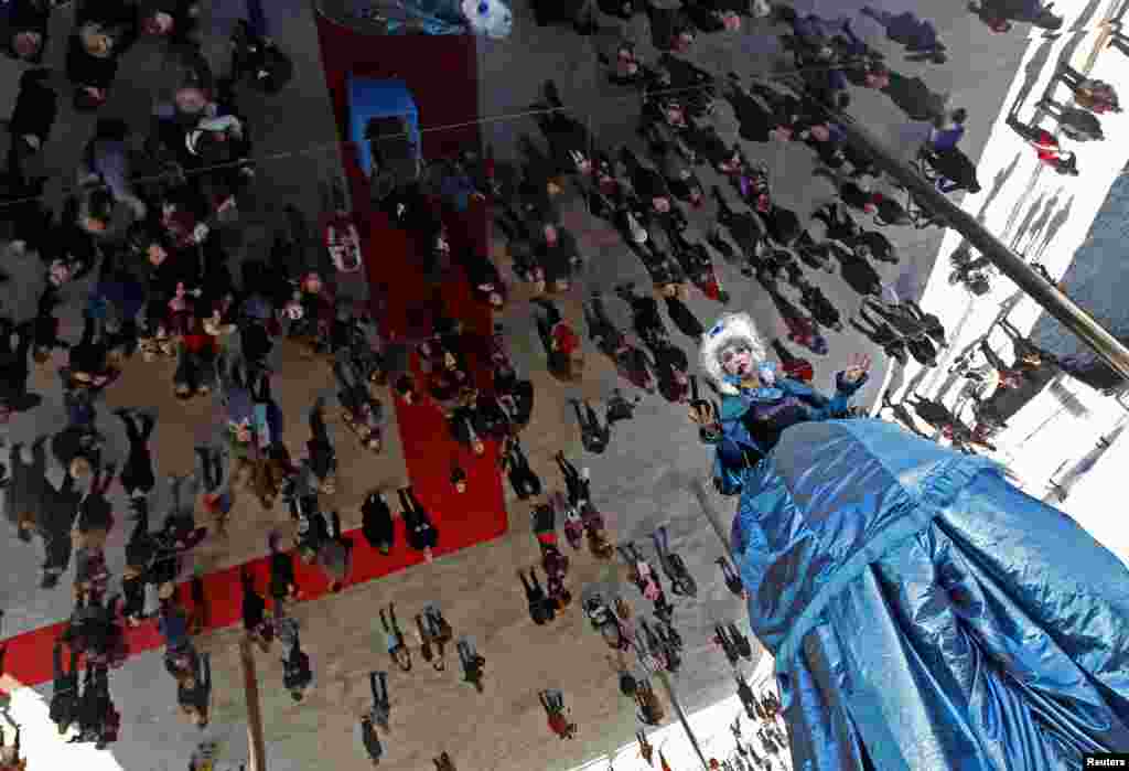 An opera singer performs during the inauguration of the mirror panels installation designed by British architect Norman Foster at the Old Harbor in Marseille, France.