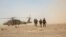 FILE - Afghan National Army 215th Corps troops disembark an Afghan Air Force Black Hawk helicopter during a troop resupply at Camp Shorabak in Helmand province, July 28, 2018. 
