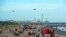 Beachgoers enjoy a day of sunshine at Galveston Beach on May 2, 2020 in Galveston, Texas, a day after the beaches reopened amid the coronavirus pandemic. 