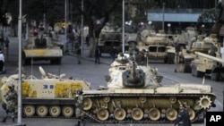 Military vehicles blocking a street in Cairo, January 30, 2011