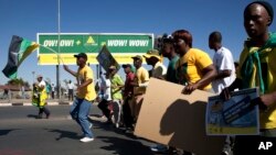 FILE - Residence take part in a march, in Soweto, Johannesburg, South Africa, Thursday, May 14, 2015. Members of the ruling African National Congress participated in a march to the power suppler Eskom offices, to protest against the power cuts-off and the installations of pre-paid meters.