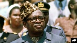 President Mobutu Sese Seko of what was then Zaire watches a military parade in Kinshasa, Zaire, June 1976. Zaire today is the Democratic Republic of Congo (DRC).