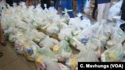 Volunteers in Harare arrange donated items destined for places affected by Cyclone Idai in Zimbabwe, March 19, 2019.