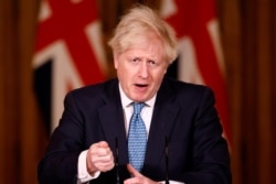 Britain's Prime Minister Boris Johnson speaks during a virtual news conference about increased travel restrictions amid the coronavirus disease (COVID-19) pandemic, at 10 Downing Street, in London, December 21, 2020.