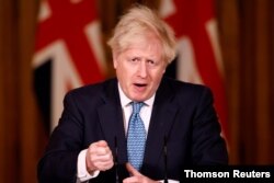 Britain's Prime Minister Boris Johnson speaks during a virtual news conference about increased travel restrictions amid the coronavirus disease (COVID-19) pandemic, at 10 Downing Street, in London, December 21, 2020.
