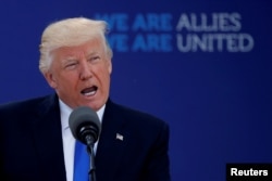 FILE - U.S. President Donald Trump attends a NATO summit at the NATO headquarters in Brussels, Belgium, May 25, 2017.