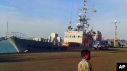 Image made from video shows U.S.-owned ship MV Seaman Ohio detained at the Tuticorin port in Tamil Nadu, India. Indian police said they are questioning the crew of the ship accused of illegally transporting weapons and ammunition in Indian waters, Oct. 13