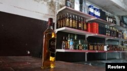 A bottle of whiskey is seen inside a liquor shop, after it was banned during the Islamic State militants' seizure of the city, in Mosul, Iraq, April 20, 2019.
