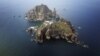 A set of remote islands called Dokdo in Korean and Takeshima in Japanese is seen in this picture taken from a helicopter August 10, 2012. 