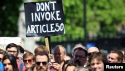 People hold banners during a 'March for Europe' demonstration against Britain's decision to leave the European Union, in central London, Britain, July 2, 2016. 