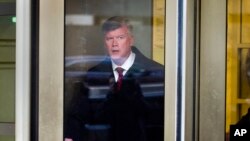 Attorney Kevin Downing, with the defense team for Paul Manafort, leaves federal court after a conference, in Washington, Dec. 11, 2018.