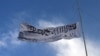 The Taliban flag flies at the Ghazni provincial governor's house, in Ghazni, southeastern, Afghanistan, Aug. 15, 2021. 