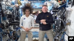 FILE - This image made from a NASA livestream shows NASA astronauts Suni Williams and Butch Wilmore during a press conference from the International Space Station, Sept. 13, 2024. 