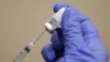 FILE - A healthcare worker draws the coronavirus disease (COVID-19) vaccine from a vial at Dignity Health Glendale Memorial Hospital and Health Center in Glendale, California, Dec. 17, 2020. 