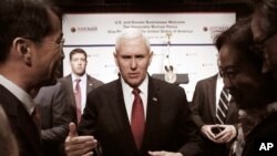 U.S. Vice President Mike Pence talks with members of the American Chamber of Commerce at the Grand Hyatt Hotel in Seoul, South Korea, April 18, 2017.