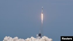 A SpaceX Falcon 9 rocket and Crew Dragon spacecraft carrying NASA astronauts Douglas Hurley and Robert Behnken lifts off during NASA?s SpaceX Demo-2 mission to the International Space Station from NASA?s Kennedy Space Center in Cape Canaveral, Florida, U.