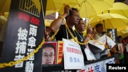 FILE - Pro-democracy protesters demanding the release of mainland activists take part in a rally in Hong Kong, China July 23, 2015.