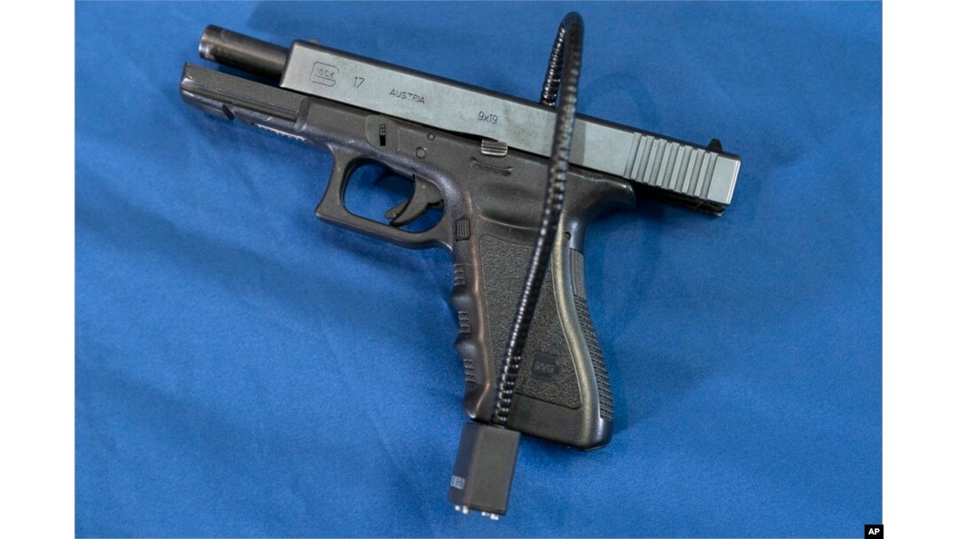 FILE - A Glock 17 pistol fitted a with a cable style gun lock in Philadelphia, May 10, 2023.