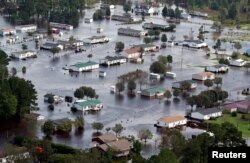 Houses sit in floodwater caused by Hurricane Florence, in this aerial picture, on the outskirts of Lumberton, North Carolina, U.S., Sept. 17, 2018.