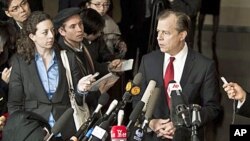 U.S. Special Representative for North Korean Affairs Glyn Davies, right, speaks to journalists at a hotel after returning from talks with North Korean counterpart in Beijing Thursday, Feb. 23, 2012.